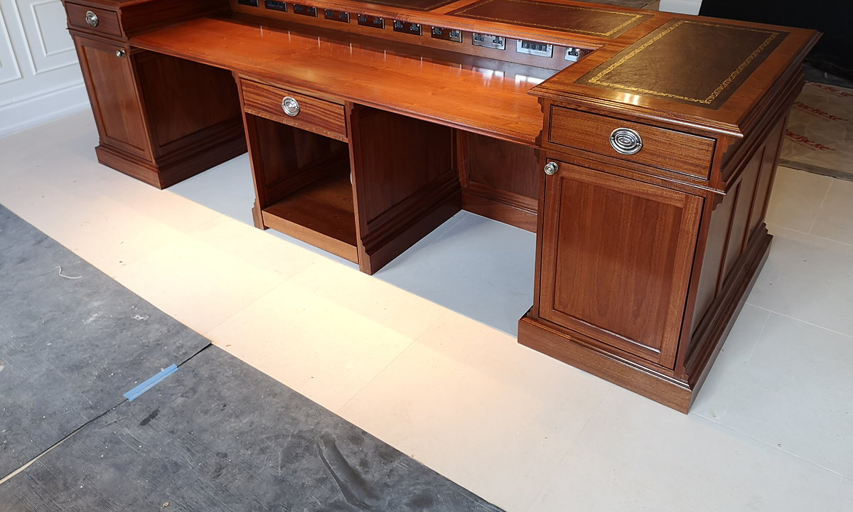The staff side of the Chewton Glen reception desk: a lower fitted counter with drawers and cupboards