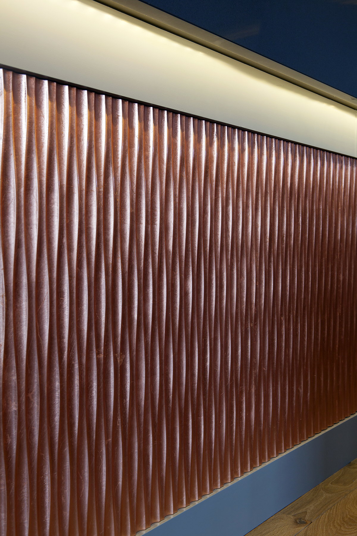 Fluted copper cladding on the front of the bar at The Kitchen, Chewton Glen