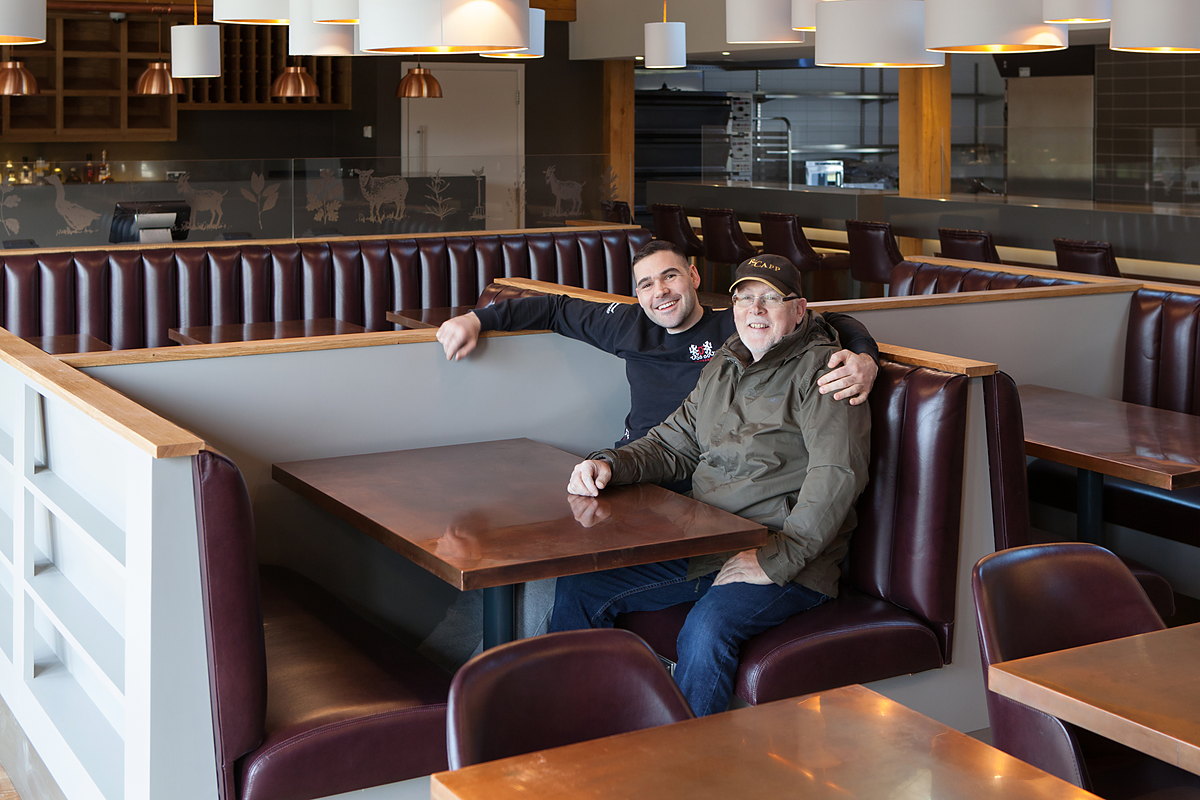 Matt O’Grady and his father Sean in one of the finished booths at The Kitchen, Chewton Glen, 2017