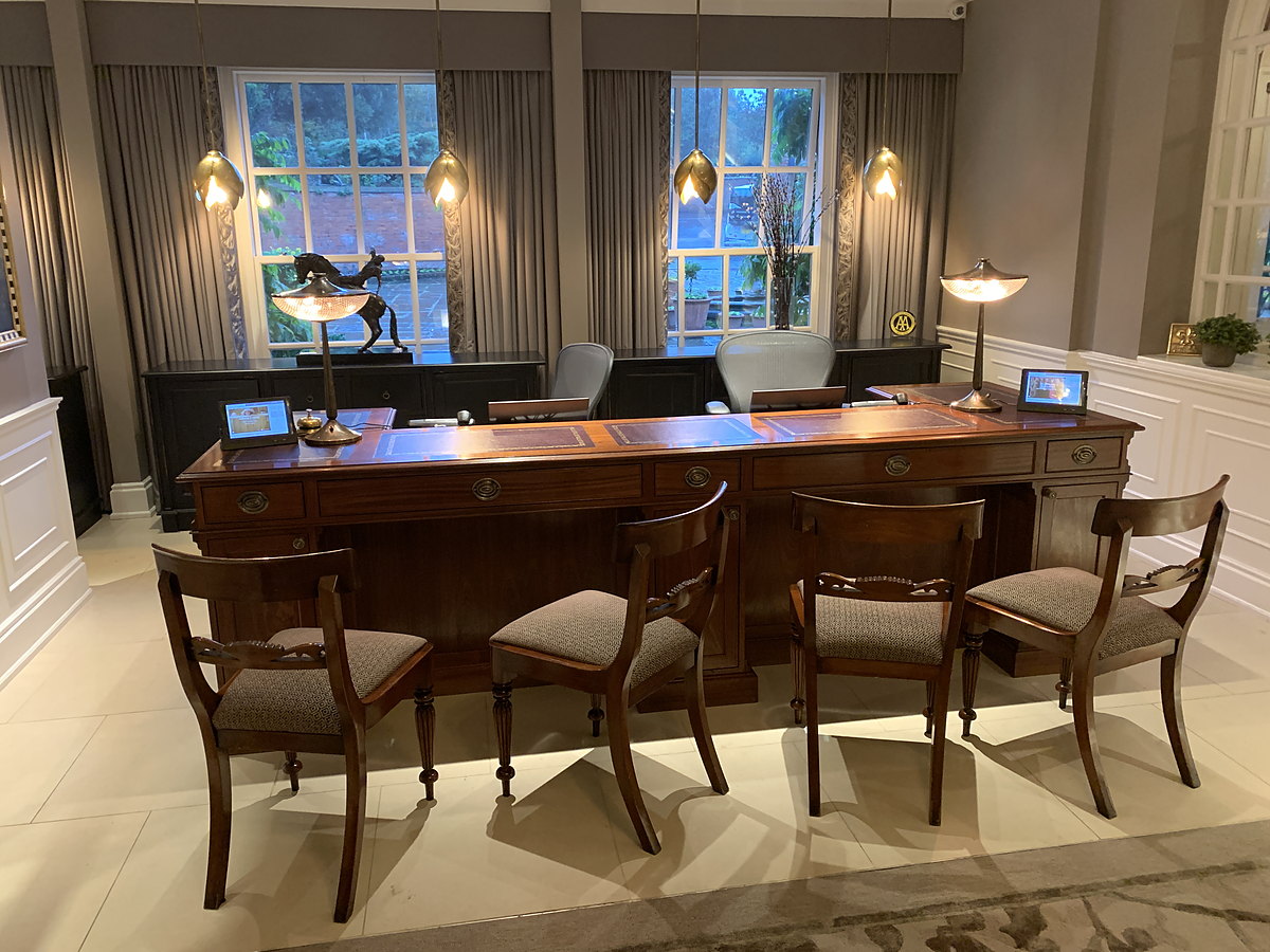 A grand panelled period dining room with a bespoke mahogany table