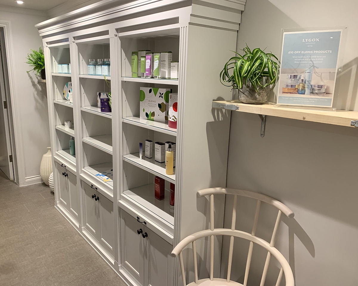Painted display cabinets with open shelves above cupboards, made and installed by MSO for the Lygon Spa at The Lygon Arms
