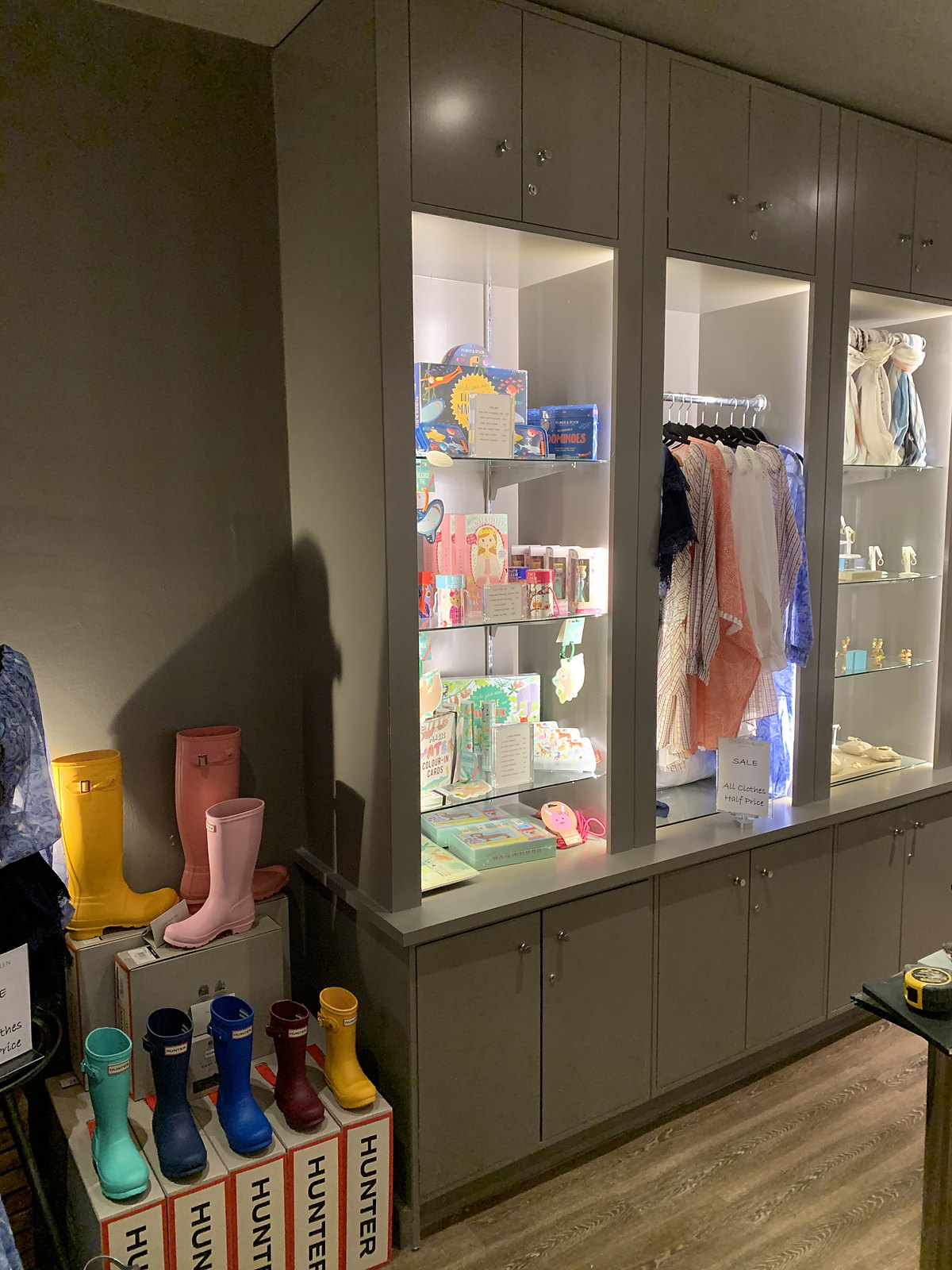 Illuminated glazed boutique display cabinets with glass shelves, made by MSO